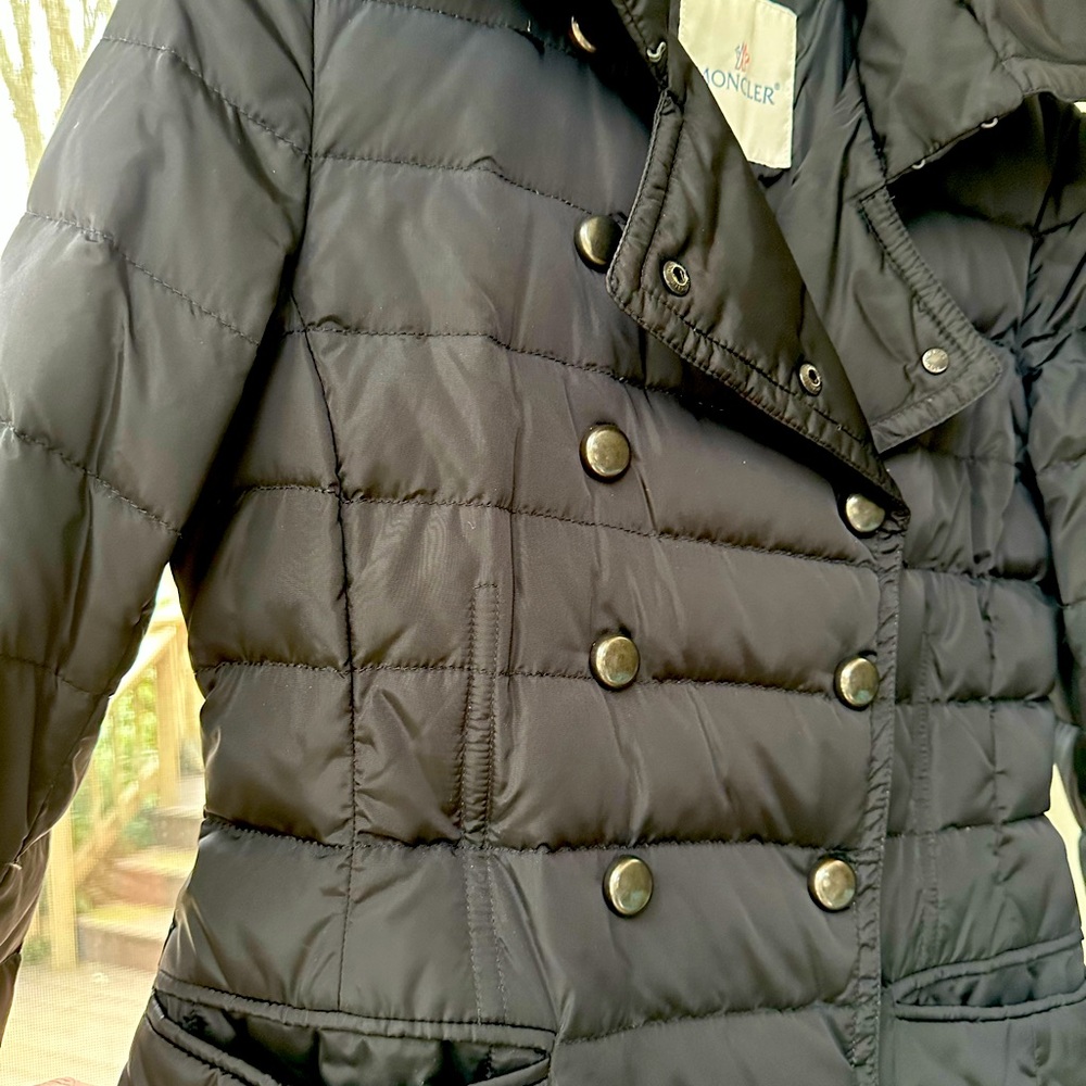 Moncler women’s black long puffer jacket